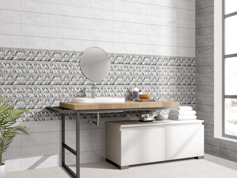 Modern grey bathroom design with floral accent tiles and a minimalist vanity